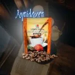 café 2 en 1 de DXN con granos de café