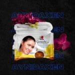 JABÓN GANOZHI única presentación más toallas blancas con flores violetas.