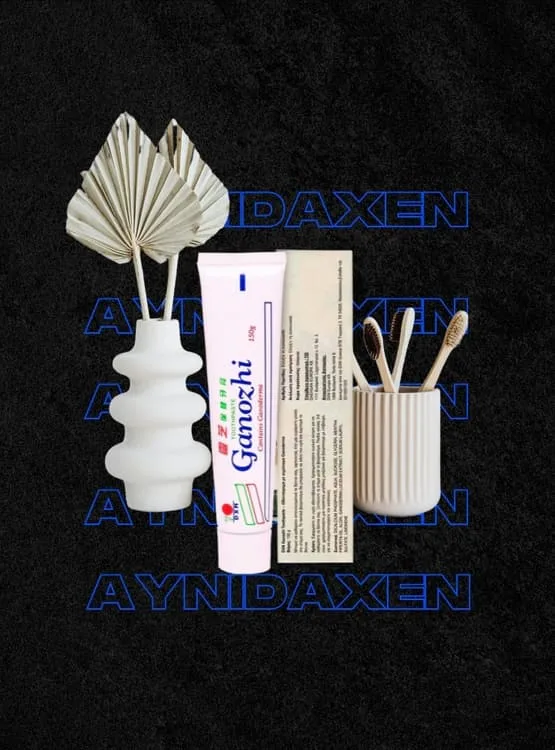 pasta dental caja sellada y pasta suelta con adornos de macetas de flores y cepillos de bambú.