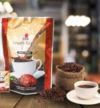 café 2 en 1 de DXN con granos de café